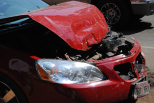 Wrecked car with mangled front end.